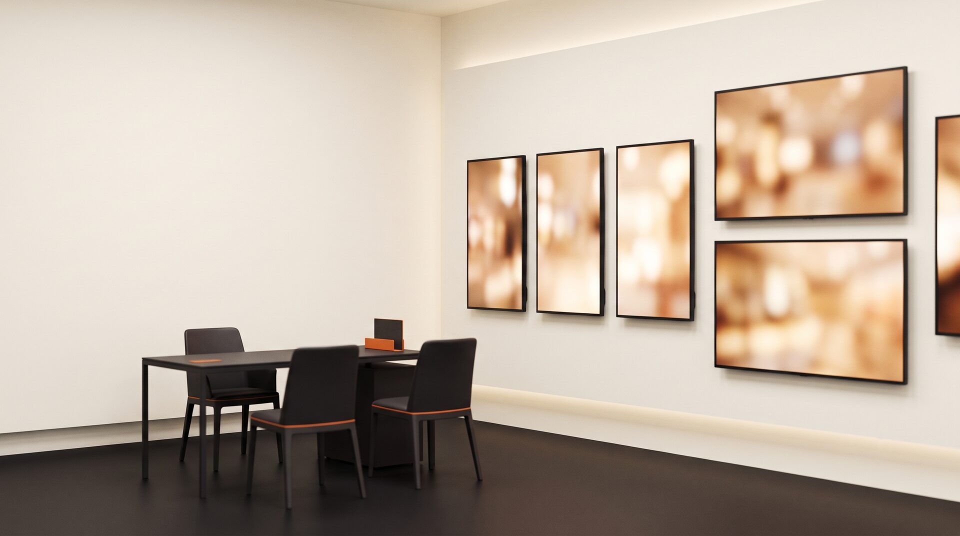 Display-Ausstellung beim Fachhändler Displaynd: mehrere Bildschirme in Hoch- und Querformat an der Wand, davor ein Beratungstisch.